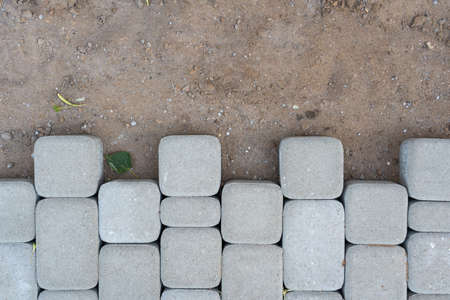 Laying paving slabs, sand and finished surface boundaryの写真素材
