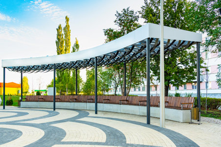 Modern gazebo with concrete benches in the city park.の写真素材