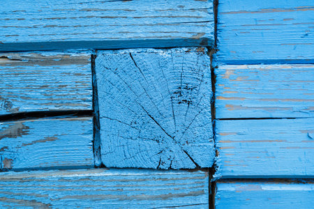 Detail of a wooden house made of timber painted with blue paintの写真素材