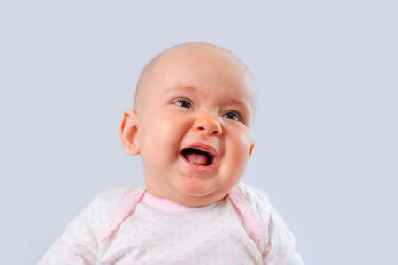 Portrait of a newborn baby with open mouthの写真素材