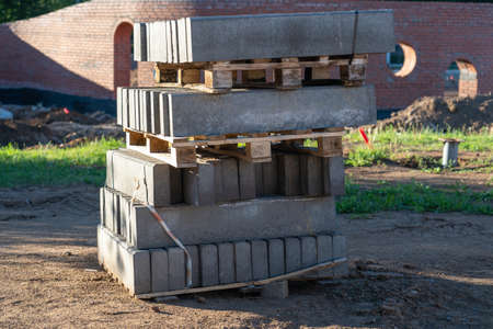 Concrete curbs for road repair on wooden palletsの写真素材