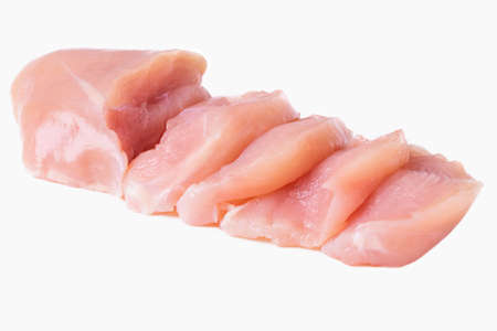 Chicken fillet cut into slices isolated on a white backgroundの写真素材