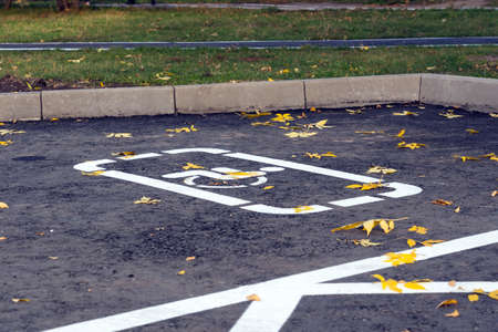 Wheelchair symbol on the parking spot for disabled peopleの写真素材