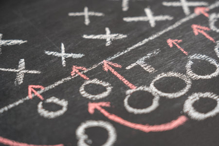 Strategy of a football game on a chalk board. Selective focusの写真素材