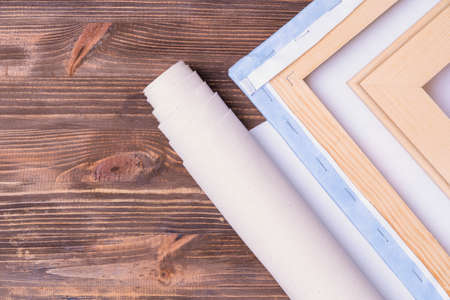 print photos on canvas. Finished paintings with a photo and a roll of canvas. top viewの写真素材