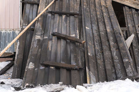 Metal profiled sheet from the roof after a fireの写真素材