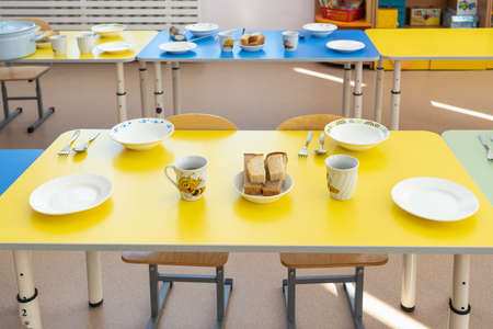 Lunch at a kindergarten in Russia. Table setting before meals.の写真素材