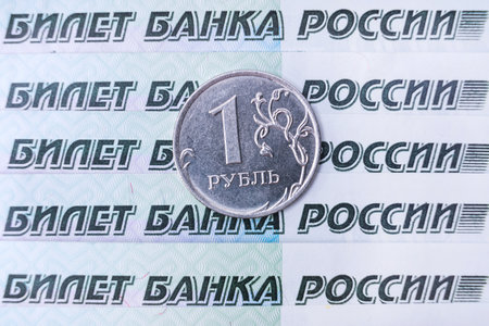 Russian money, banknotes in denominations of one thousand rubles and a coin with a face value of one rubleの写真素材