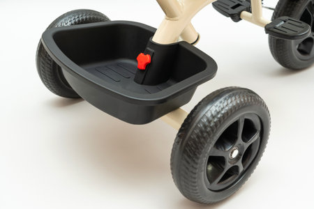 Trunk attached to the back of a children's tricycle close-up, selective focusの写真素材