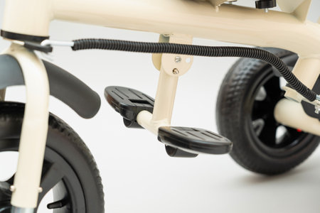 A footrest on a children's tricycle stroller with a handle. selective focusの写真素材