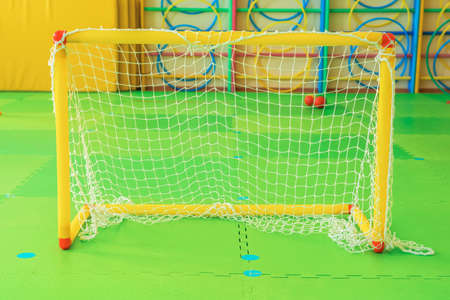 A small soccer goal in the kindergarten gym. close up