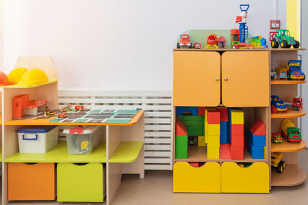 March 09, 2022 Neftekamsk, Russia: The interior of a kindergarten, toys laid out on the shelves of the cabinetのeditorial素材