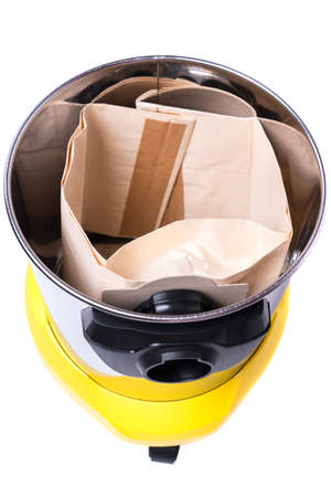 garbage bag installed inside a yellow construction vacuum cleanerの写真素材