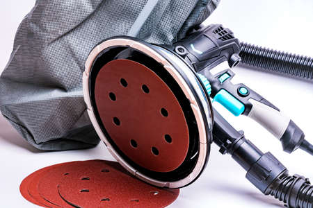 Vacuum grinder connected to a dust bagの写真素材