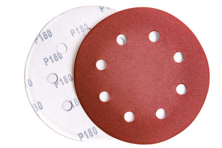 Circular sandpaper discs with 180 grit hook-and-pile fasteners isolated on white backgroundの写真素材