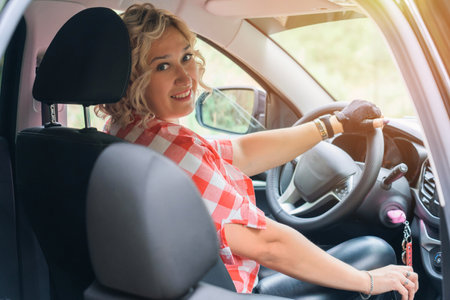 Blonde woman driving a car with a manual transmissionの写真素材