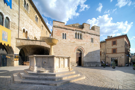July 21, 2021, Bevagna, Umbria, Italy. Bevagna, Umbria Piazza Silvestri with the church of San Silvestro and medieval fountain.のeditorial素材