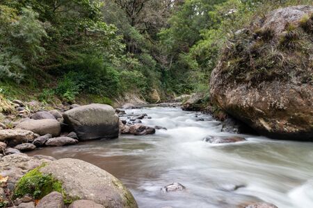 Sumpul river between El Salvador and Honduras, Central America. Forest and mountain river landscape, Country border. Rocks and river foam.の写真素材