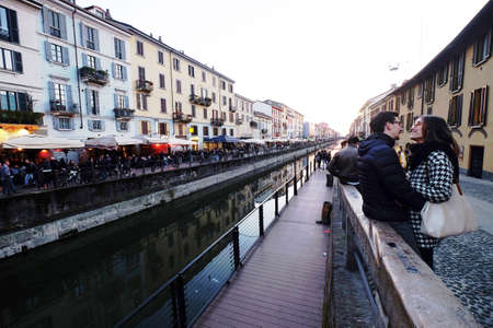 March 2017-young beautiful couple lovers hugging in the street, Navigli, Milan,Italyのeditorial素材
