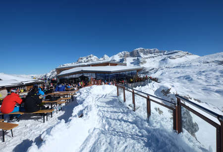 February 2019-Skiers enjoy their outdoor lunch break on the snow, Brenta Dolomites, Trentino, Italyのeditorial素材