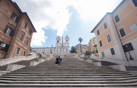Tourists taking pictures at Piazza de Spagna Square of Spain. At the bottom of the Spanish Steps, is one of the most famous squares in Rome, Italy. Rome architecture and landmark.のeditorial素材