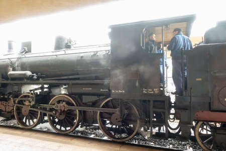Old Italian restored steam locomotive train natura, park on the platform. Siena, Italyのeditorial素材