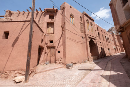Ancient building in the mountain village Abyaneh, Iran. Zoroastrian village. Narrow street with unique houses. Characteristic red houses in the central part of Iran.のeditorial素材