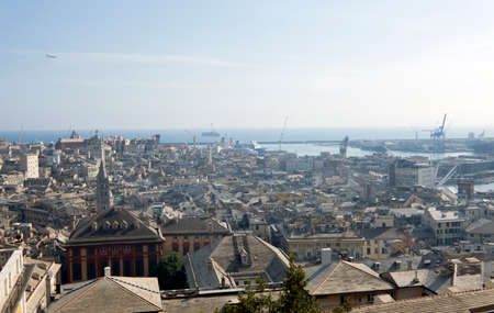 Italy, urban view of the skyline of the historic city of Genoa in Liguria, old and new buildings with views of the commercial port,のeditorial素材