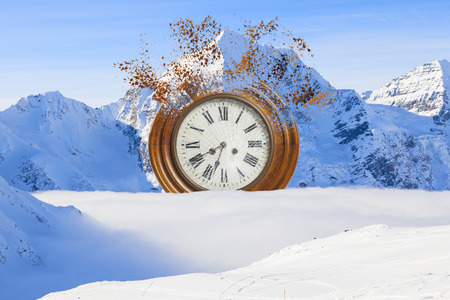 surreal and broken clock on the snowの写真素材