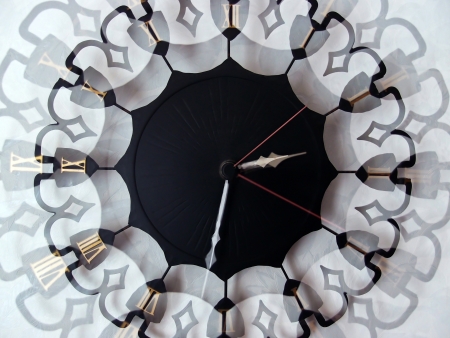 Wall clock with pointers with Roman Numerals overlay effectの写真素材