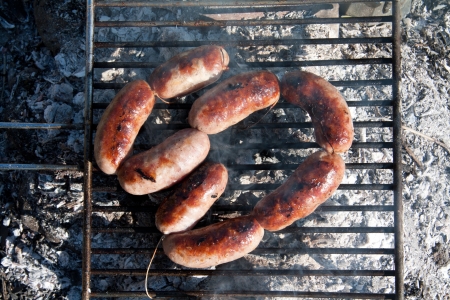 Sausages on the grill in open air.の写真素材