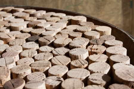 Collection of used wine corks on the upper surface of an old barrelの写真素材