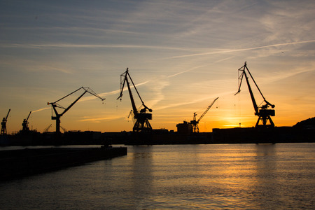 Harbor cranes at sunset. Image taken in Gothenburg, Swedenの写真素材