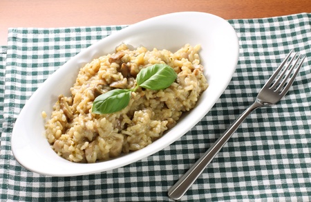 Risotto with mushrooms on tableの写真素材