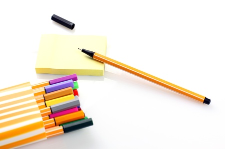 Post-It with pen on white backgroundの写真素材