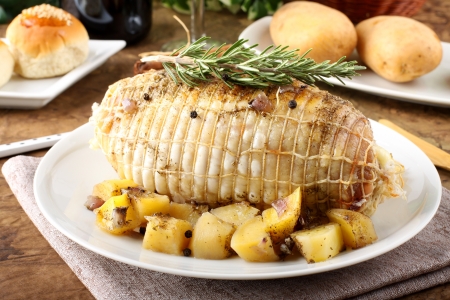Chicken roll stuffed  with baked potatoes on complex backgroundの写真素材