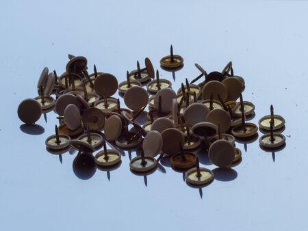 thumbtacks in a white background