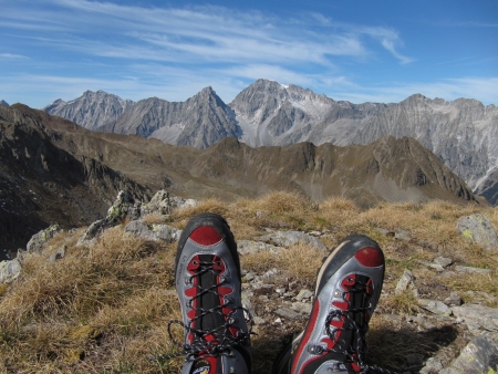 Mt Regelspitze, South Tyrol, ITALY - September  29, 2011: Some moments of relax on the top of Mt Regelspitze, after more than 4 hours of trekking in a special wild environment beetwen Italy and Austria. The shoes are from LaSportiva collection.のeditorial素材