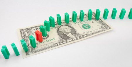 domino on one US dollar billの写真素材