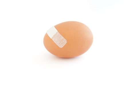 Damaged egg in white backgroundの写真素材