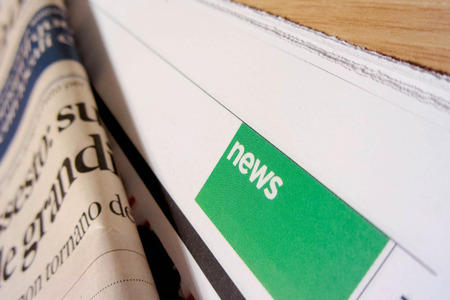 Hannover, Germany - April 16, 2010 - Focus on news section over \"Recharge\"  newspaperのeditorial素材