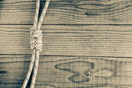 Junction between two mountain ropes on wooden background