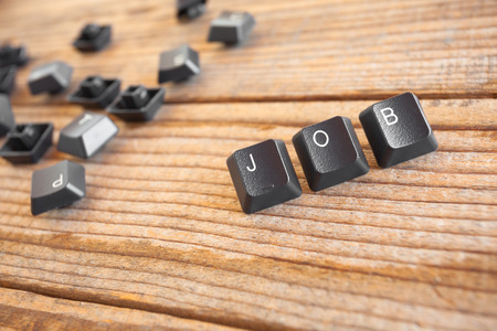 "JOB" wrote with keyboard keys on wooden backgroundの写真素材