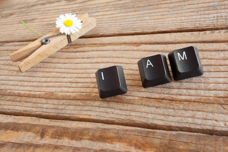 I AM wrote with keyboard keys on wooden backgroundの写真素材