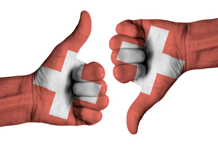 Swiss flag on human male handsの写真素材