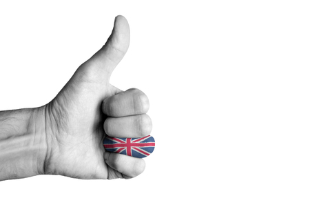 UK flag on human male thumb up handの写真素材