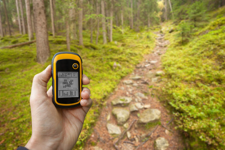 finding the right position in the forest via gpsの写真素材