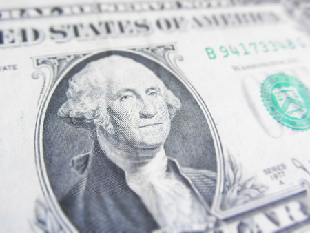 Details of a one dollar bill, George Washington in foreground
