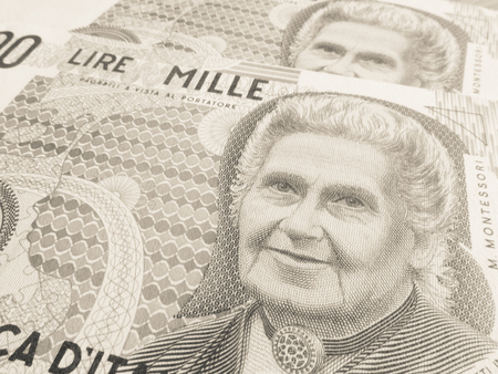 Montessori over an old one thousand Lire  Italian billの写真素材