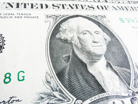 Details of a one dollar bill, George Washington in foreground